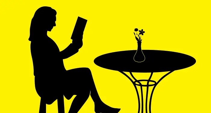 woman sitting at table silhouette